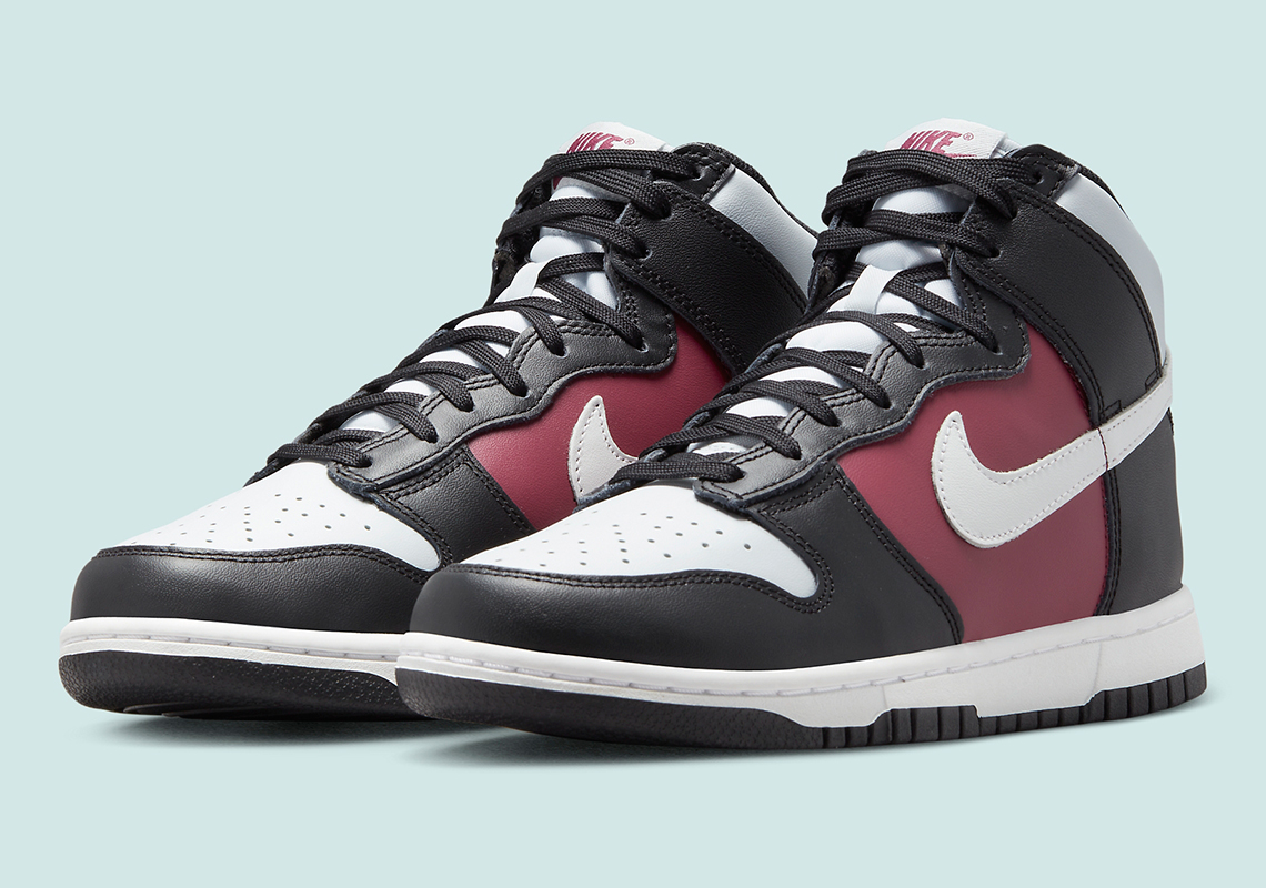 Một sự pha trộn của màu đen, trắng và maroon xuất hiện trên giày sneaker Nike Dunk High Black White Maroon