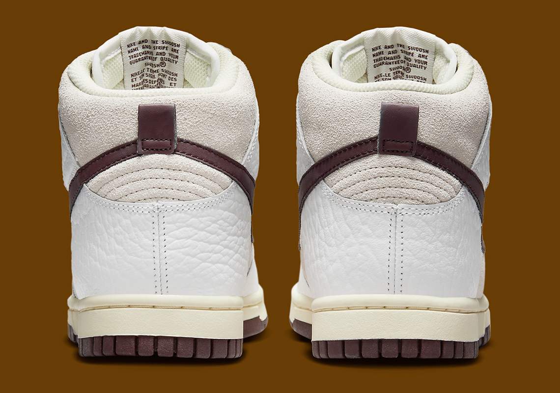 Tông màu cổ điển được phối cho đôi giày nữ Nike Dunk High này - 5